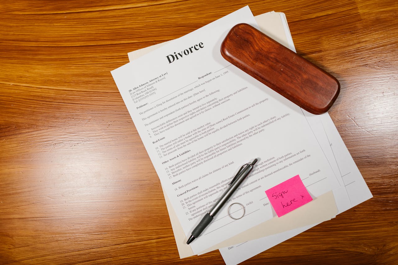 Crafting Captivating Headlines: Your awesome post title goes here Flat lay of divorce papers with a pen and ring on a wooden table for legal themes.